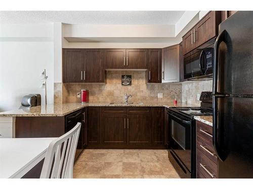 1134-1540 Sherwood Boulevard Nw, Calgary, AB - Indoor Photo Showing Kitchen With Upgraded Kitchen