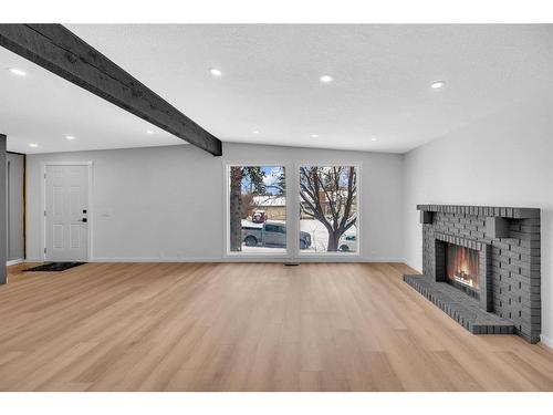 741 120 Avenue Sw, Calgary, AB - Indoor Photo Showing Living Room With Fireplace