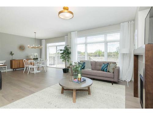 44 Emberside Green, Cochrane, AB - Indoor Photo Showing Living Room