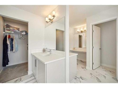 247 Precedence Hill, Cochrane, AB - Indoor Photo Showing Laundry Room