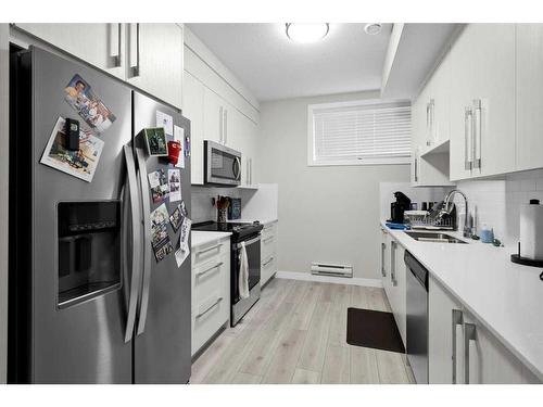 533 Walgrove Boulevard Se, Calgary, AB - Indoor Photo Showing Kitchen With Double Sink