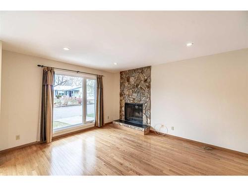 7 Deerbow Place Se, Calgary, AB - Indoor Photo Showing Living Room With Fireplace