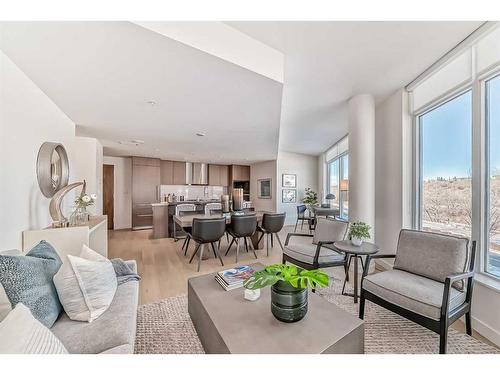 202-128 Waterfront Court Sw, Calgary, AB - Indoor Photo Showing Living Room