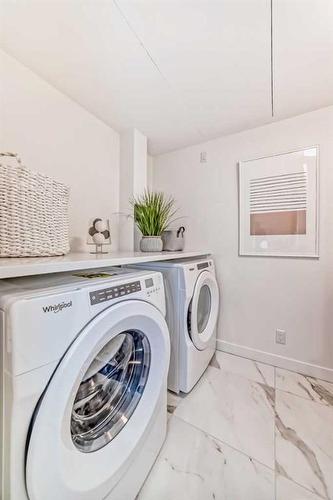 202-128 Waterfront Court Sw, Calgary, AB - Indoor Photo Showing Laundry Room