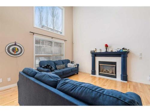 42 Crestmont Drive, Calgary, AB - Indoor Photo Showing Living Room With Fireplace