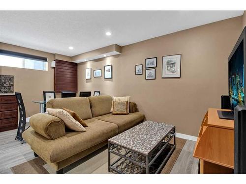 239 Douglasbank Drive Se, Calgary, AB - Indoor Photo Showing Bedroom With Fireplace