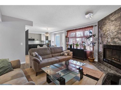 239 Douglasbank Drive Se, Calgary, AB - Indoor Photo Showing Living Room With Fireplace
