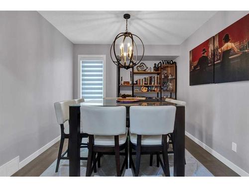 239 Douglasbank Drive Se, Calgary, AB - Indoor Photo Showing Dining Room With Fireplace