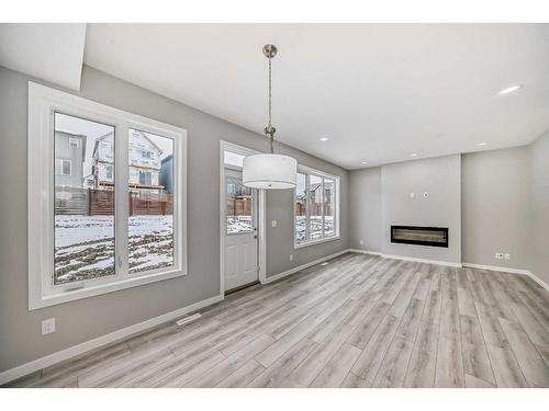 199 Lucas Close Nw, Calgary, AB - Indoor With Fireplace