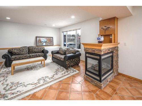 5638 Coach Hill Road Sw, Calgary, AB - Indoor Photo Showing Living Room With Fireplace