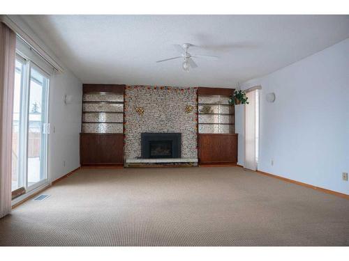 127 Whiteview Close Ne, Calgary, AB - Indoor With Fireplace