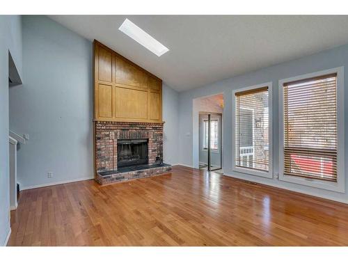 4016 46 Street Sw, Calgary, AB - Indoor Photo Showing Living Room With Fireplace