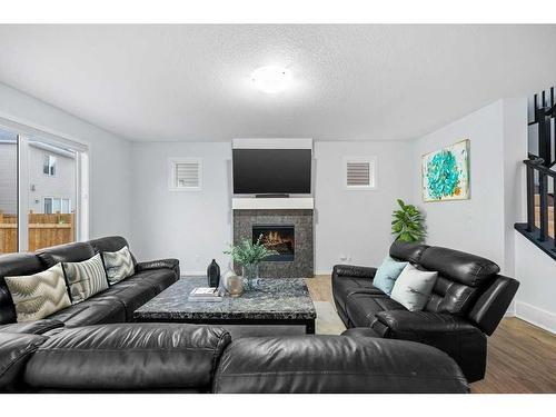 13 Cityspring Common Ne, Calgary, AB - Indoor Photo Showing Living Room With Fireplace