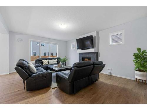 13 Cityspring Common Ne, Calgary, AB - Indoor Photo Showing Living Room With Fireplace