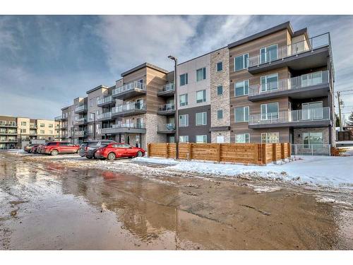 405-200 Shawnee Square Sw, Calgary, AB - Outdoor With Balcony With Facade