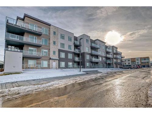 405-200 Shawnee Square Sw, Calgary, AB - Outdoor With Balcony With Facade