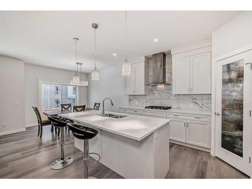208 Dawson Harbour Heights, Chestermere, AB - Indoor Photo Showing Kitchen With Double Sink With Upgraded Kitchen