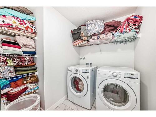208 Dawson Harbour Heights, Chestermere, AB - Indoor Photo Showing Laundry Room