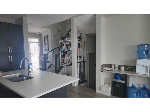 146 Marquis Common Se, Calgary, AB - Indoor Photo Showing Kitchen With Double Sink