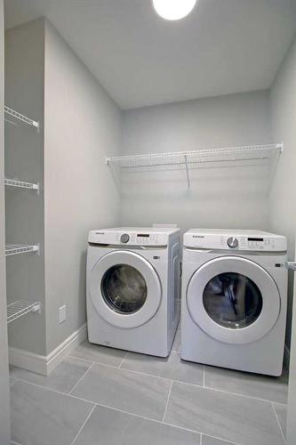 22 Belgian Crescent, Cochrane, AB - Indoor Photo Showing Laundry Room