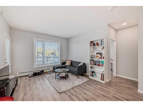 103-150 Shawnee Square Sw, Calgary, AB - Indoor Photo Showing Living Room