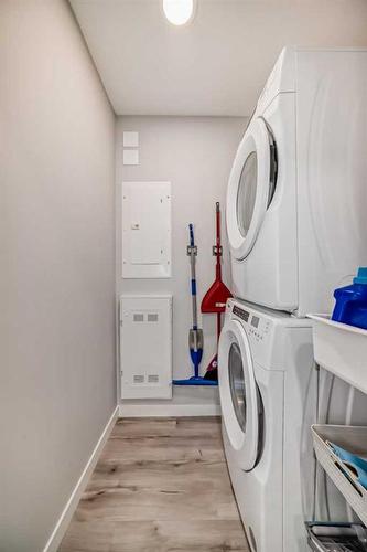 103-150 Shawnee Square Sw, Calgary, AB - Indoor Photo Showing Laundry Room