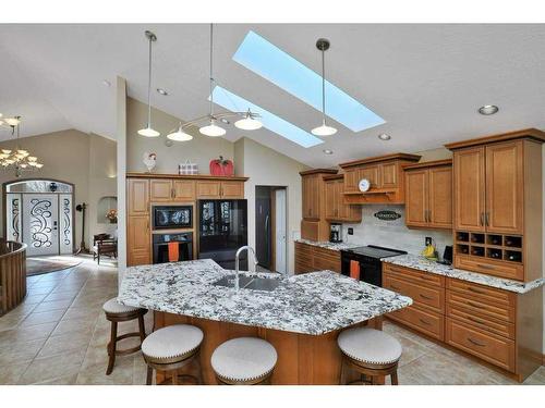 105 Park Meadows Place, Olds, AB - Indoor Photo Showing Kitchen With Double Sink