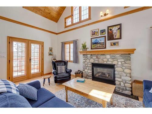 48 Elk Willow Road, Bragg Creek, AB - Indoor Photo Showing Living Room With Fireplace