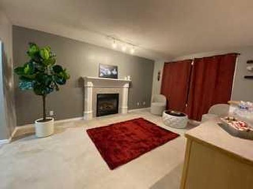 172 Covewood Green Ne, Calgary, AB - Indoor Photo Showing Living Room With Fireplace