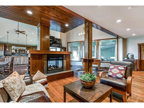 264390 Forestry Trunk Road, Rural Rocky View County, AB - Indoor Photo Showing Living Room With Fireplace