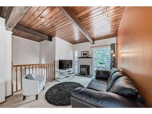 116 Rundlewood Lane Ne, Calgary, AB - Indoor Photo Showing Living Room With Fireplace