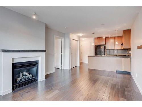 429-35 Richard Court Sw, Calgary, AB - Indoor With Fireplace
