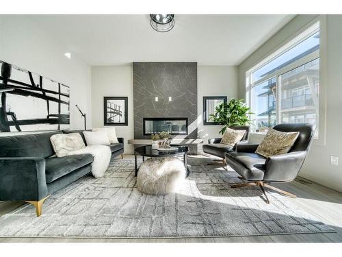 549 Savanna Drive Ne, Calgary, AB - Indoor Photo Showing Living Room With Fireplace