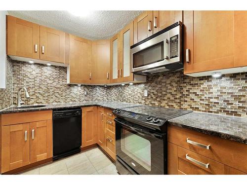 607-13104 Elbow Drive Sw, Calgary, AB - Indoor Photo Showing Kitchen With Double Sink