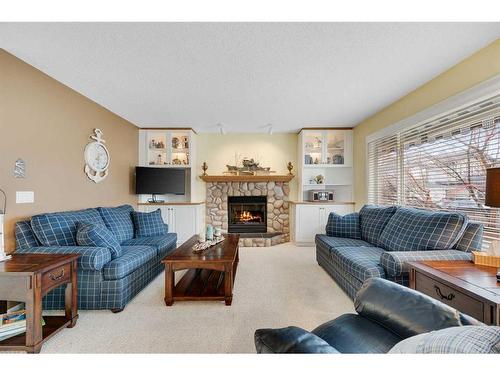 133 Cranfield Park Se, Calgary, AB - Indoor Photo Showing Living Room With Fireplace