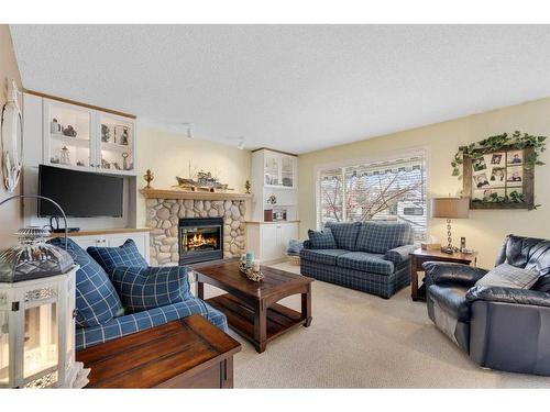 133 Cranfield Park Se, Calgary, AB - Indoor Photo Showing Living Room With Fireplace
