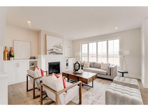 657 Quarry Way Se, Calgary, AB - Indoor Photo Showing Living Room With Fireplace