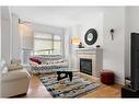 205-4 14 Street Nw, Calgary, AB  - Indoor Photo Showing Living Room With Fireplace 