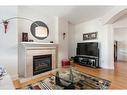 205-4 14 Street Nw, Calgary, AB  - Indoor Photo Showing Living Room With Fireplace 