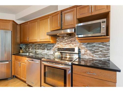 205-4 14 Street Nw, Calgary, AB - Indoor Photo Showing Kitchen With Stainless Steel Kitchen