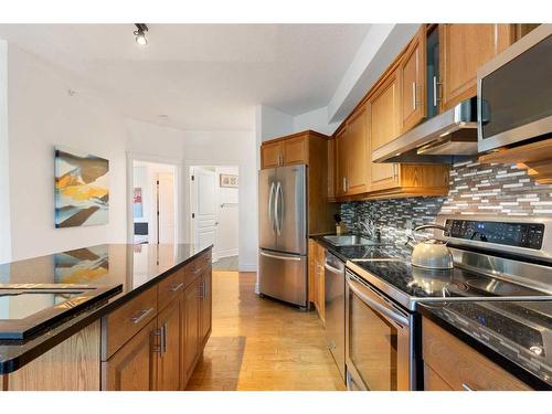 205-4 14 Street Nw, Calgary, AB - Indoor Photo Showing Kitchen With Stainless Steel Kitchen