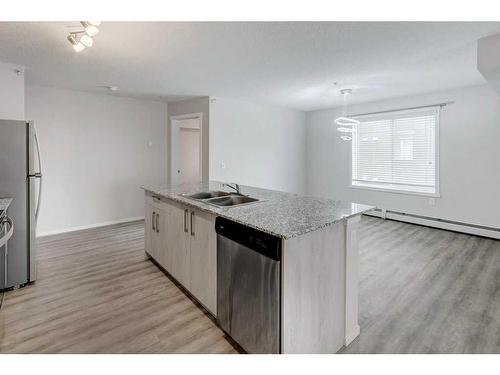 3202-4641 128 Avenue Ne, Calgary, AB - Indoor Photo Showing Kitchen With Double Sink