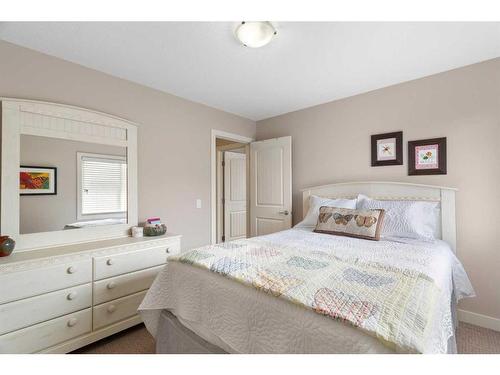 405 Boulder Creek Way Se, Langdon, AB - Indoor Photo Showing Bedroom