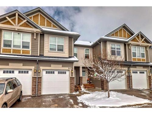 647-101 Sunset Drive, Cochrane, AB - Outdoor With Facade