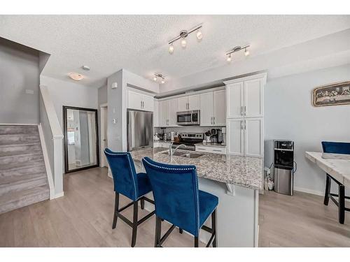 647-101 Sunset Drive, Cochrane, AB - Indoor Photo Showing Kitchen With Stainless Steel Kitchen With Upgraded Kitchen