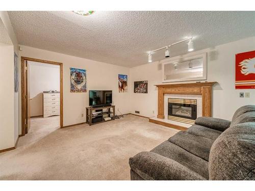 230 Hamptons Park Nw, Calgary, AB - Indoor Photo Showing Living Room With Fireplace