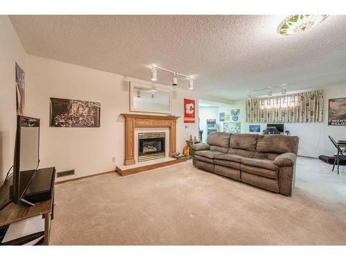 230 Hamptons Park Nw, Calgary, AB - Indoor Photo Showing Living Room With Fireplace