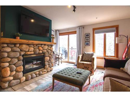 202-743 Railway Avenue, Canmore, AB - Indoor With Fireplace