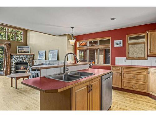 2-817 5Th Street, Canmore, AB - Indoor Photo Showing Kitchen With Fireplace With Double Sink