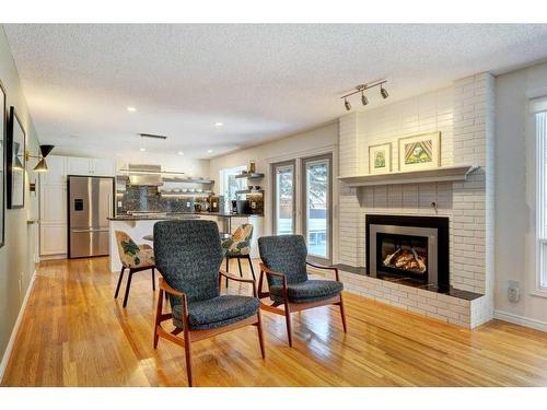 660 Willow Brook Drive Se, Calgary, AB - Indoor Photo Showing Living Room With Fireplace